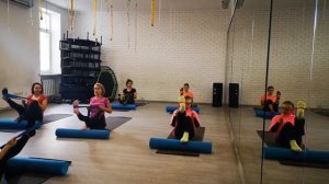 Пилатес с роллами на вытяжение позвоночника.Pilates with rollers for stretching the spine.