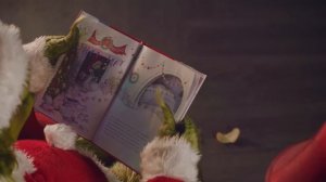 The Grinch Reads "How the Grinch Stole Christmas!"
