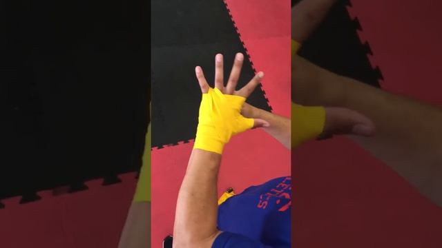 How to wrap your hands for boxing with Coach Nelson