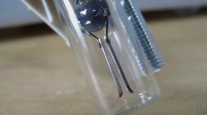 Fluorescent lamp starter close-up detail.