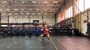 Приседание с 2 гирями на груди