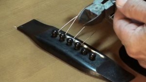 Tips for removing bridge pins on acousric guitar by Randy Schartiger Quick Clip Tips