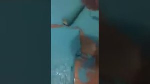 Маленький Захар красит стену