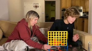 Teaching our autistic and nonverbal son how to play Connect 4!