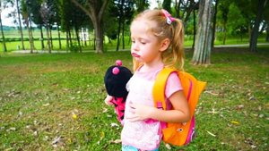 Stacy and baby doll sleeping at park