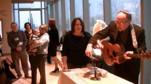 Lighting the candle on the first night of Hanukkah