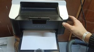 Как распечатать тестову страничку на brother 1112r без помощи компютора?