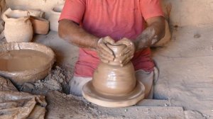 Master Pottery Maker Forming the Clay into Beautiful Vessels