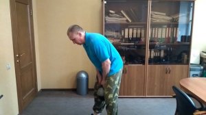 Приседания с гирей.
