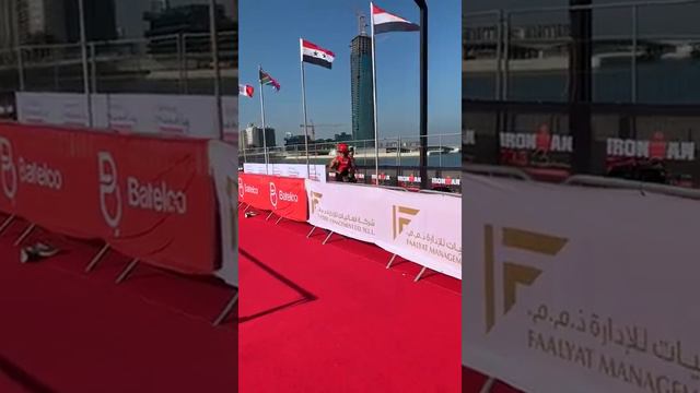 2019 IRONMAN 70.3 Middle East Championship Bahrain -T2 Relay Handover Mark Cavendish to Sir Mo Fara