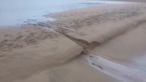 Black Rock River ( mahlongwa) river breaching into the Indian ocean