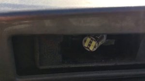 заміна лампочки підсвітки номера Nissan Note