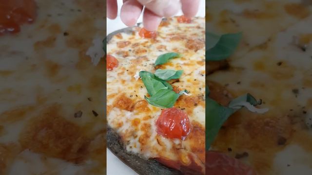 Pizza with cherry tomato, cheese, and basil