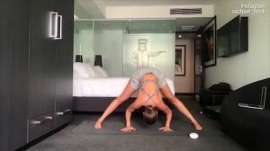 Rachael Finch completes a yoga session inside her hotel room