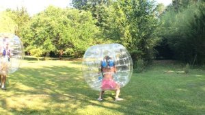 Bumper ball bubble battle! Funny lawn game. Bumper soccer fun