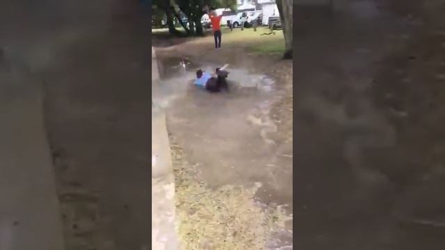 Kid goes crazy jumps in mud puddle part 2