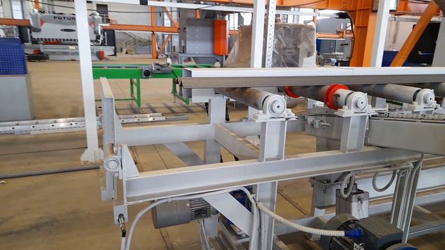 Система поперечной перекладки на рольганг дробеметной камеры