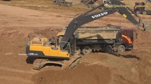 Volvo EC250DL Excavator Digging Loading Deawoo Dump Truck. 1080HD Video.
