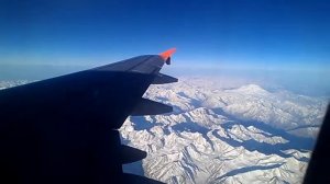 Airbus A319 flight in the sky on mountains Kazbek,Georgia