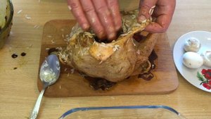 Курица фаршированная рисом , грибами и луком.