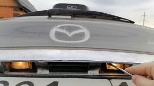 Замена лампочек штатной подсветки номера Mazda Biante