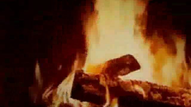 У камина