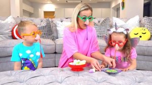 Gaby and Alex playing Snort it game with mama