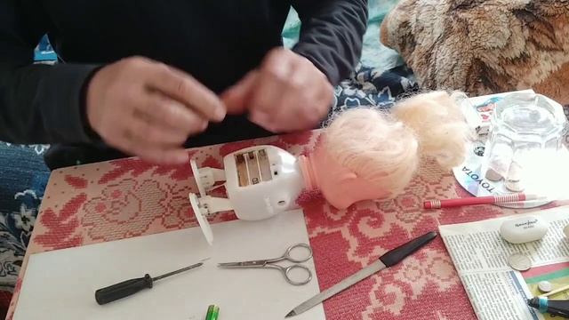 Результат ремонта куклы Маши.