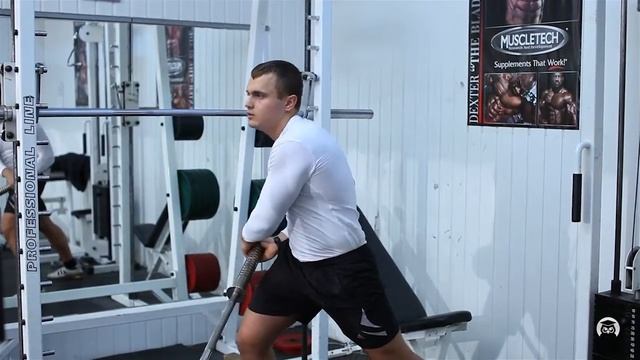 Повороты в стороны стоя с т - образной штангой