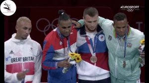British boxer Ben Whittaker REFUSES to wear his silver medal on the podium stuffs it in his pocket