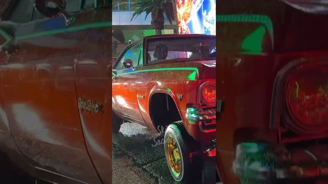 LOWRIDERS HITTIN’ SWITCHES IN THE RAIN! ☔️ CHEVY IMPALA 3 WHEEL MOTION on Las Vegas Blvd; the Strip