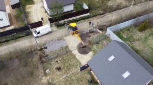 Закрытие канавы перед участком, устройство заезда, выравнивание участка.