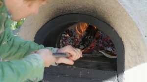 Jamie Oliver shows you how to cook pizza in a wood fired oven