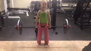 6 year old deadlifting body weight - 40lbs with Rogue Fitness 2.5kg bar