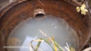 септик серых вод из старых кусков жести и бочки