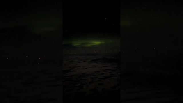 Северное сияние из кабины самолёта над Ханты-Мансийском