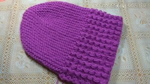 Шапка  спицами красивым узором и укороченными рядами.