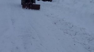 Чистка снега на минитракторе грейдерным отвалом