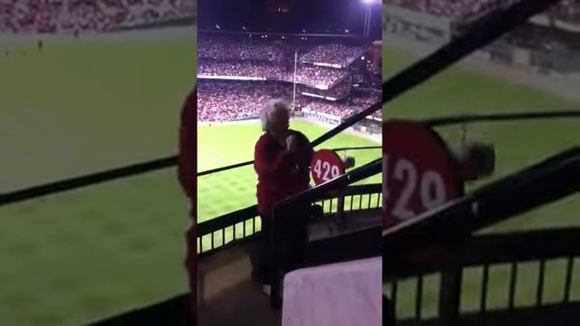 old lady dancing at cards game