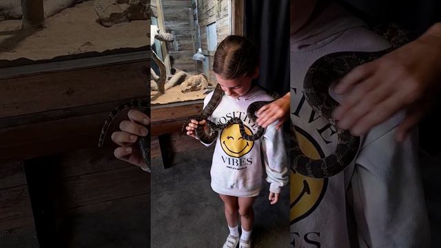 Matilda holding a snake at the Funky Farm