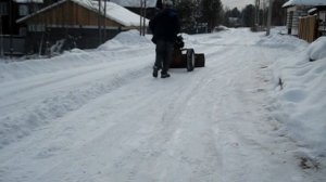 Убираем снег мотоблоком.