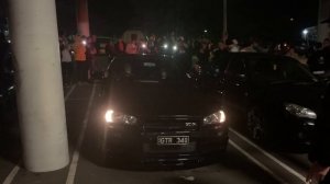 Big flames R34 GTR G42 turbo 2-stepping at a car meet!