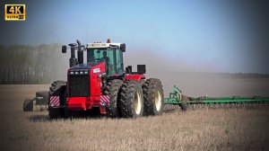 Трактор Ростсельмаш 2375 в агрегате с пружинной бороной - работа в поле