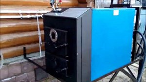 Монтаж твердотопливного котла длительного горения Космос-35 на улице