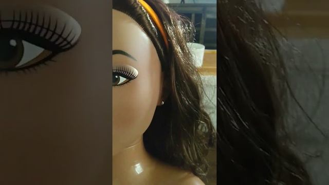 brushing curly hair to the side