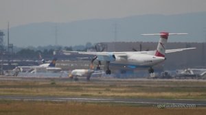 Бомбардье DHC 8 авиакомпании Austrian Airlines приземляется в аэропорту Франкфурта. Замедленная съём