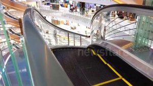 Спиральный эскалатор в Китае