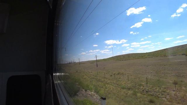 Телевышка Агадыря (Ағадыр) видна из окна поезда летом 2021 года смотреть онлайн