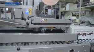 Автоматическая заклейка скотчем картонных коробок с продукцией