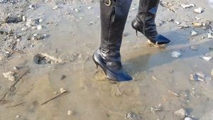Buffalo high heel boots in mud
